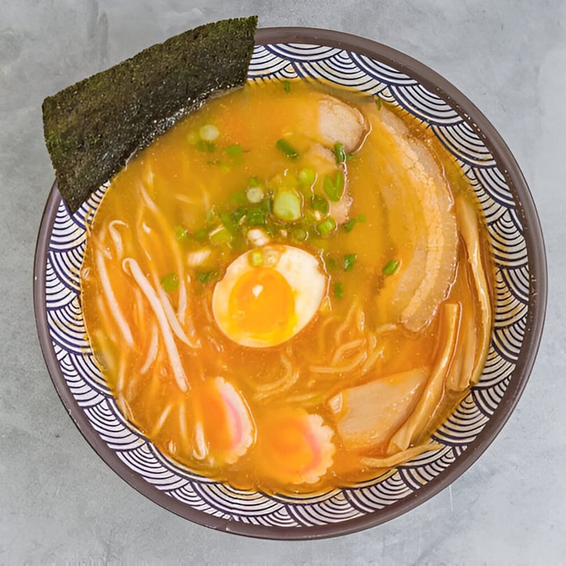 Overhead view of a bowl of Kailani Shave Ice & Ramen's ramen with egg, pork, and seaweed.